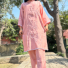 This co-ords consists of tunic and trousers Pink & white embroidered tunic, has round neck three-quarter sleeves, and regular waist hem Pink solid mid-rise trousers, has slip-on closure